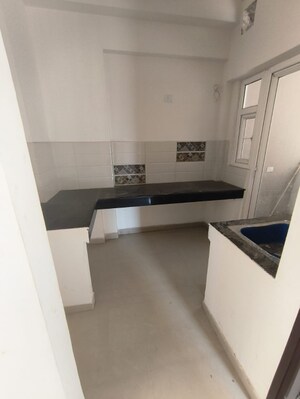 Kitchen in 2 BHK Apartment at Shri Radha Aqua Garden, Sector 16b Greater Noida – for Sale