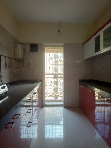 Kitchen in 2.5 BHK Apartment at Rosa Oasis, Thane West – for Rent