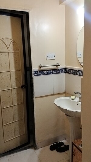 Bathroom in 1 BHK Apartment at Sai Dham CHS, Dhanori – for Rent