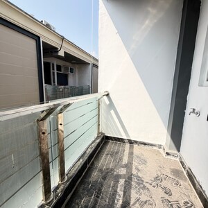 Balcony in 2 BHK Apartment at Palm Residency Chhatarpur, Rajpur Khurd Extension – for Rent