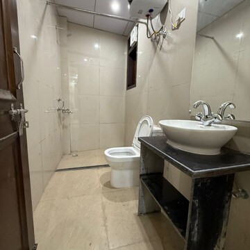 Bathroom in 2 BHK Apartment at Palm Residency Chhatarpur, Rajpur Khurd Extension – for Rent