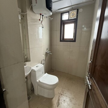 Bathroom in 2 BHK Apartment at Palm Residency Chhatarpur, Rajpur Khurd Extension – for Rent