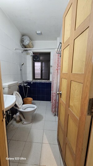 Bathroom in 2 BHK Apartment at Subhangan CHS, Malad West – for Rent