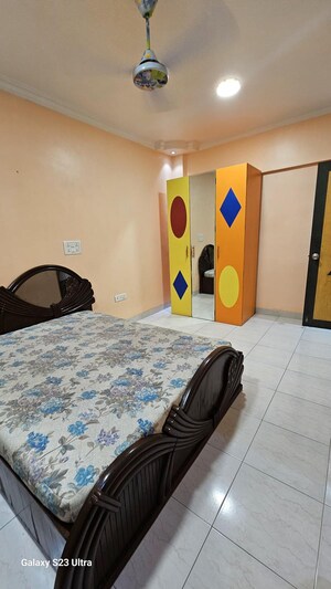 Bedroom in 2 BHK Apartment at Subhangan CHS, Malad West – for Rent