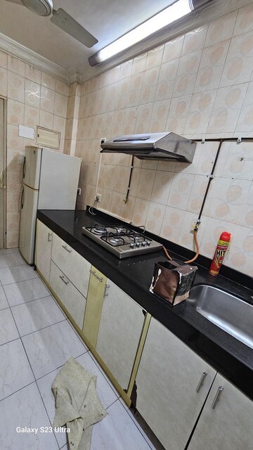 Kitchen in 2 BHK Apartment at Subhangan CHS, Malad West – for Rent