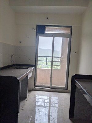 Kitchen in 1 BHK Apartment at Mahavir Kalpavruksha, Ghodbunder Road – for Sale
