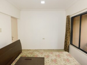 Bedroom in 3 BHK Apartment at Dheeraj Gaurav Heights, Jogeshwari West – for Rent
