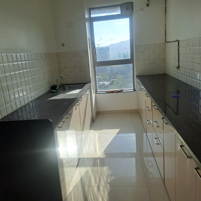 Kitchen, kalpataru-immensa 2 Bedroom 808 Sq.Ft. Apartment In Kolshet Road Thane 9317470
