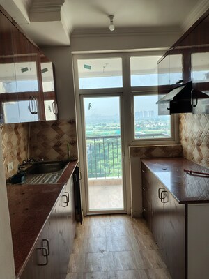 Kitchen in 2 BHK Apartment at Amrapali Riverview, Amrapali Leisure Valley – for Rent