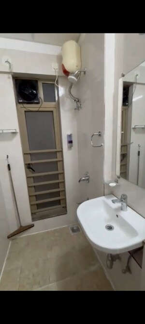 Bathroom in 2 BHK Apartment at Sheth Vasant Oasis, Andheri East – for Rent