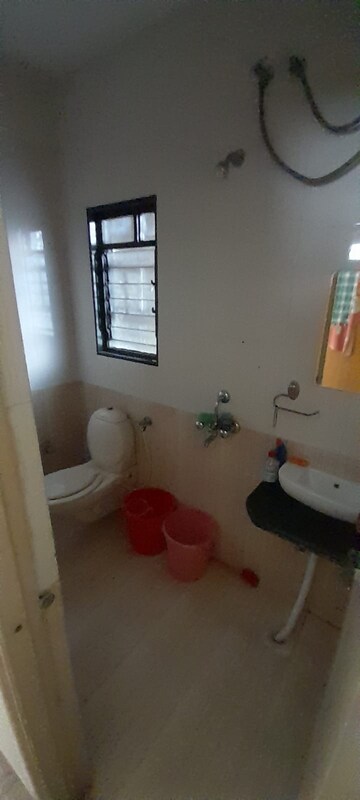 Bathroom in 1 BHK Apartment at Saurabh CHS Karve Nagar, Karve Nagar – for Sale