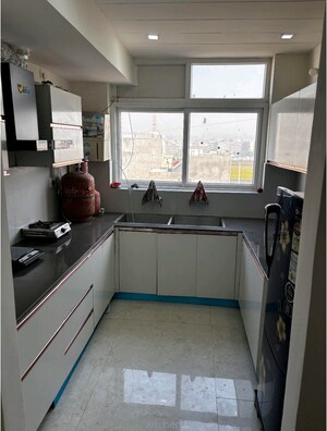 Kitchen in 2 BHK Apartment at Aura Homes, Patiala Road – for Rent