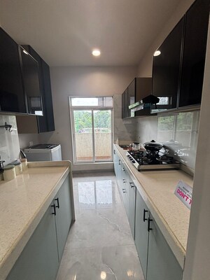 Kitchen in 1.5 BHK Apartment at Godrej Emerald, Ghodbunder Road – for Sale