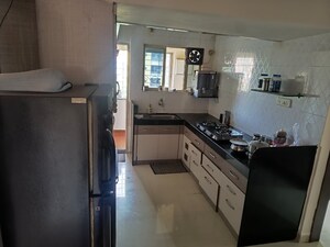Kitchen in 3 BHK Apartment at Essentia CHS, Rahatani – for Rent