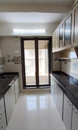 Kitchen in 2 BHK Apartment at Abrol Avirahi Heights, Malad West – for Rent