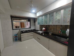 Kitchen in 2 BHK Apartment at Suyog CHS Naupada, Naupada – for Sale