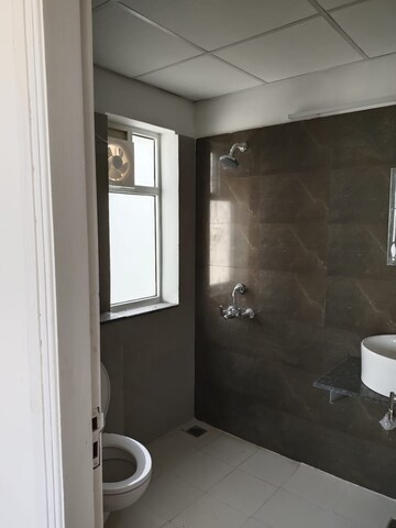 Bathroom in 3 BHK Apartment at International Airport Road – for Rent
