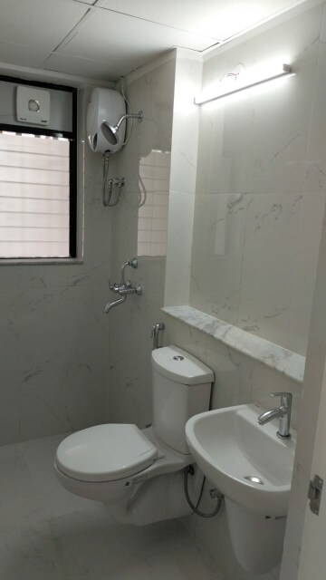 Bathroom in 1 BHK Apartment at Runwal Gardens, Dombivli East – for Rent