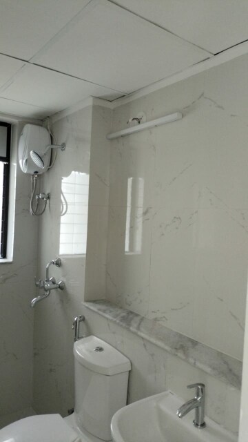 Bathroom in 1 BHK Apartment at Runwal Gardens, Dombivli East – for Rent