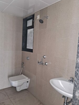 Bathroom in 1 BHK Apartment at Runwal Gardens, Dombivli East – for Rent