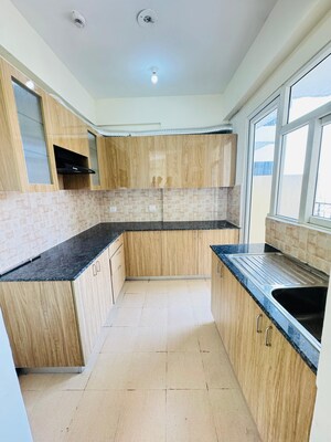 Kitchen in 3 BHK Apartment at Amrapali Crystal Homes, Sector 76 – for Sale