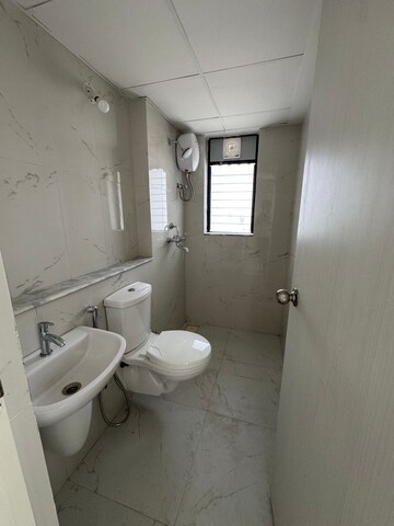 Bathroom in 1 BHK Apartment at Runwal Gardens, Dombivli East – for Rent