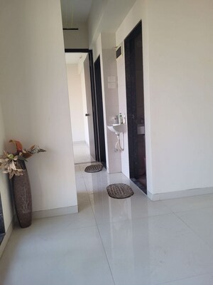 Building Lobby in 2 BHK Apartment at Juhi Niharika Residency, Kharghar Sector 34 – for Rent