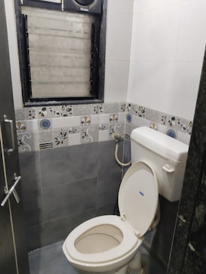 Bathroom in 1.5 BHK Apartment at Camp Universal Apartment, Camp – for Sale