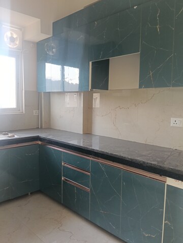 Kitchen in 2.5 BHK Apartment at Smart World Gems, Sector 89 – for Rent