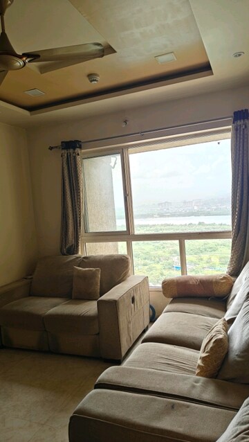 Living Room in 2 BHK Apartment at Lodha Amara, Kolshet Road – for Rent