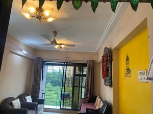 Living Room in 1 BHK Apartment at Ahuja Sea Crown, Kandivali West – for Rent