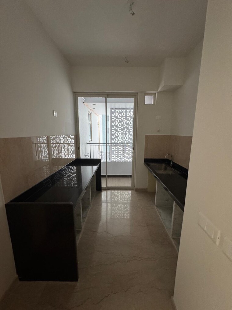 Kitchen, courtyard-by-narang-realty-and-the-wadhwa-group 2 Bedroom 830 Sq.Ft. Apartment In Pokhran Road No Two Thane 9324579