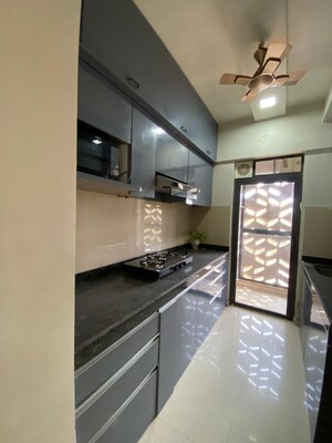 Kitchen in 3 BHK Apartment at Runwal Gardens Phase I, Dombivli East – for Rent