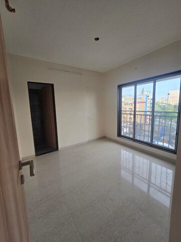 Room in 2 BHK Apartment at Ajmera Boulevard, Malad West – for Rent