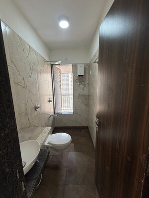 Bathroom in 1 BHK Apartment at Raunak Bliss, Ghodbunder Road – for Rent