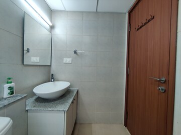 Bathroom in 2 BHK Apartment at Bhartiya Nikoo Homes Phase 2, Thanisandra Main Road – for Rent