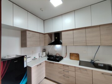 Kitchen in 2 BHK Apartment at Bhartiya Nikoo Homes Phase 2, Thanisandra Main Road – for Rent