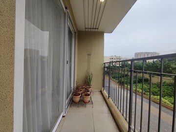 Balcony in 2 BHK Apartment at Bhartiya Nikoo Homes Phase 2, Thanisandra Main Road – for Rent