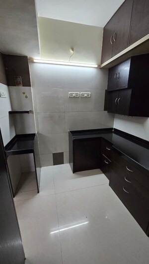Kitchen in 1 BHK Apartment at Borbhat SRA Society, Borivali West – for Rent