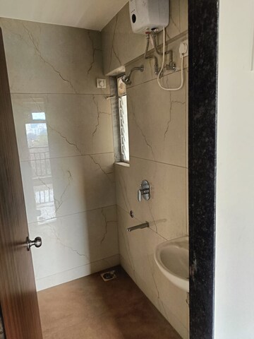 Bathroom in 1 BHK Apartment at Raunak Unnathi Woods Phase 7 A And B, Ghodbunder Road – for Sale