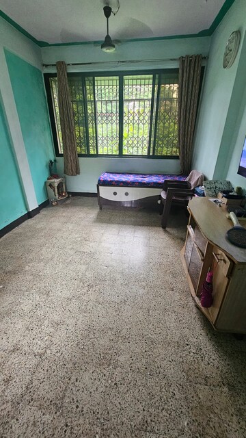 Living Room in 1 BHK Apartment at Bhagirathi Smriti CHS, Thane West – for Sale