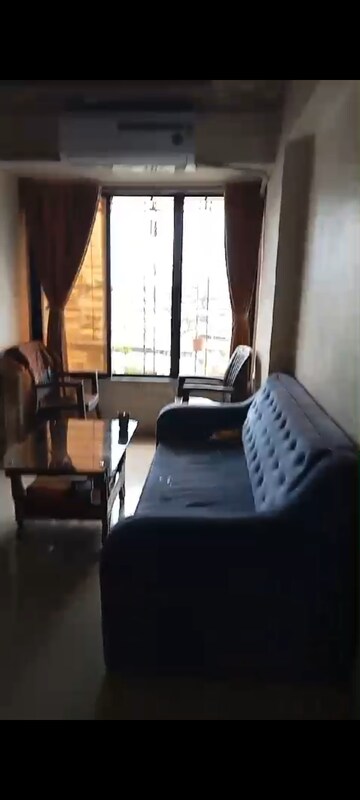 Living Room in 1 BHK Apartment at Bhagirathi Smriti CHS, Thane West – for Sale
