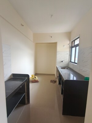 Kitchen in 1 BHK Apartment at Ram Pushpanjali Residency, Owale – for Rent