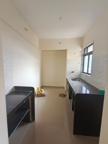 Kitchen in 1 BHK Apartment at Pushpanjali Heights, Owale – for Rent