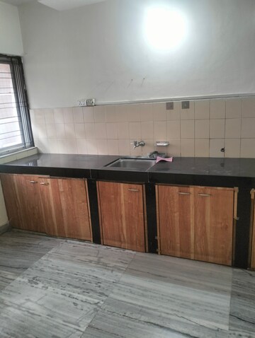 Kitchen in 1 BHK Apartment at Dorabjee Elegance, Nibm – for Rent