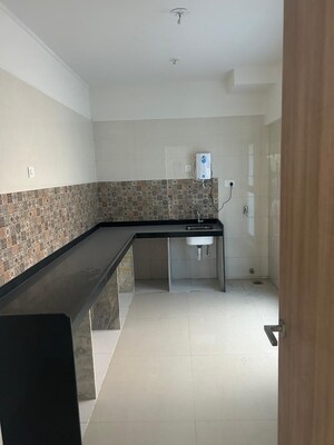 Kitchen in 4 BHK Apartment at Rajesh Raj Infinia, Malad West – for Rent