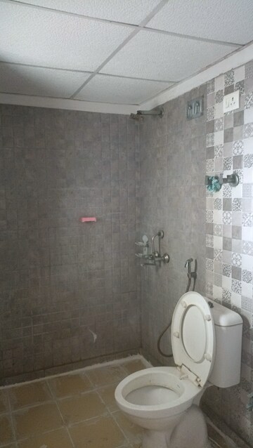 Bathroom in 2 BHK Apartment at Aims Golf City, Sector 75 – for Rent