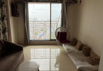 Living Room in 1 BHK Apartment at Shraddha Evoque, Bhandup West – for Sale
