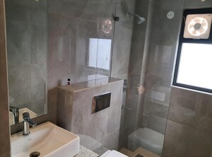 Bathroom in 3 BHK Apartment at Suncity Vatsal Valley, Gwal Pahari – for Rent