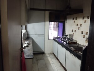 Kitchen in 2 BHK Apartment at Arjun CHS Vasant Vihar, Vasant Vihar – for Sale